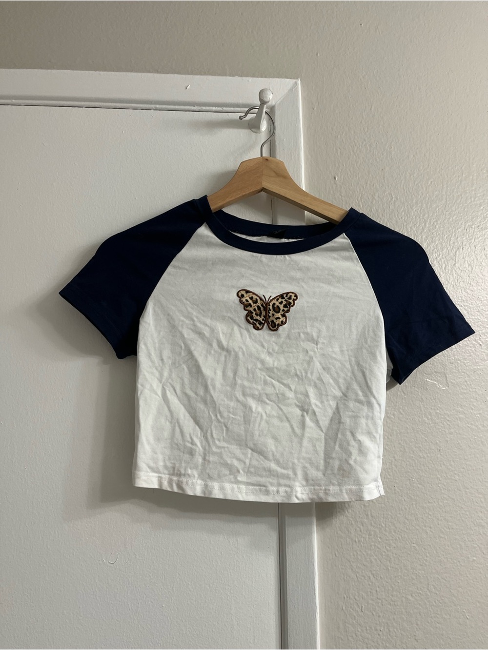 SHEIN White Crop Tee with Navy Raglan Sleeves & Leopard Butterfly Patch